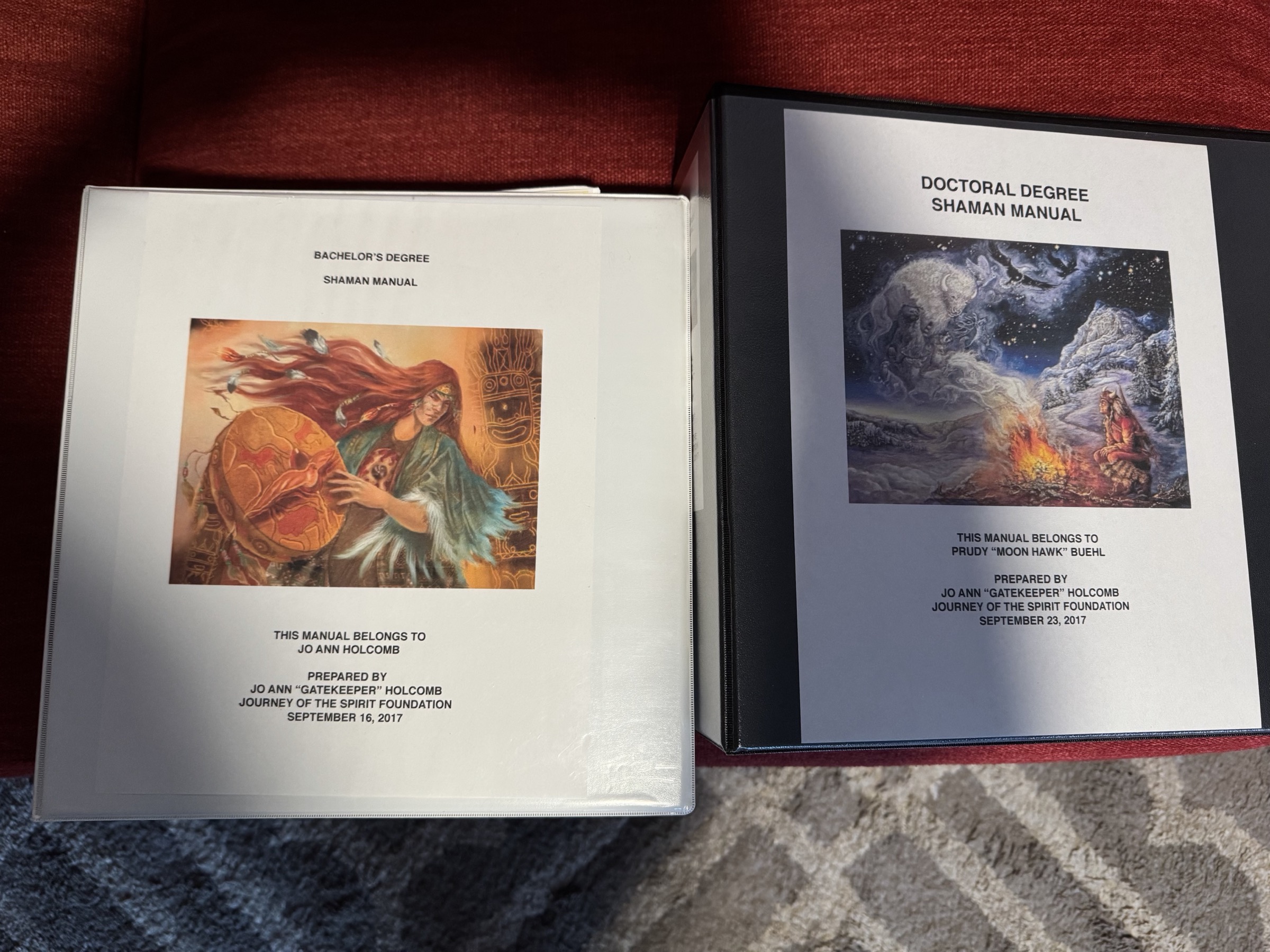 Shamanic lineage manuals laid beside bachelor and doctoral credentials.