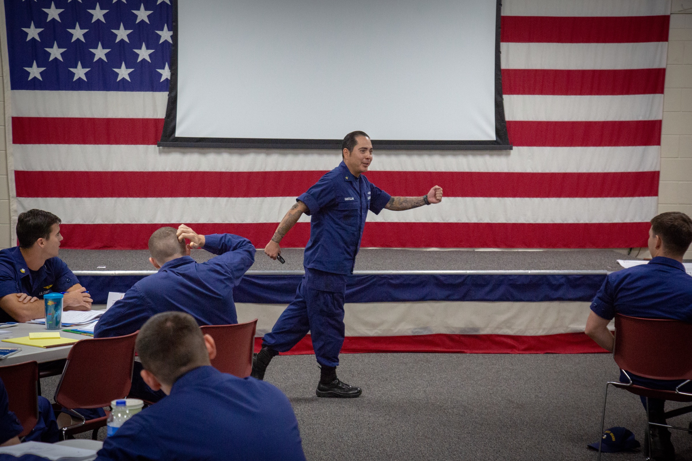 Mundo teaching a leadership class at LAMS Clearwater — mid-gesture before the room.